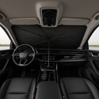 Car interior with a black umbrella covering the dashboard
