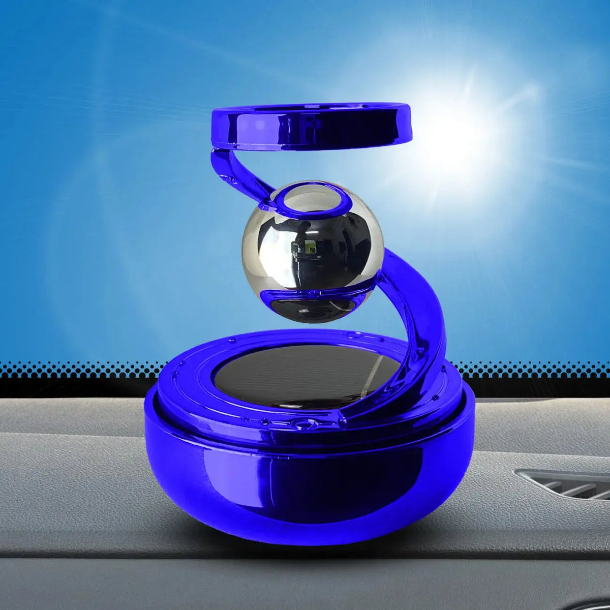 Blue solar rotating car air freshener on dashboard